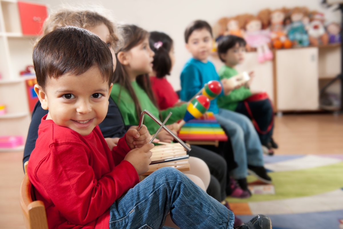 Children playing with vibrant blocks in preschool